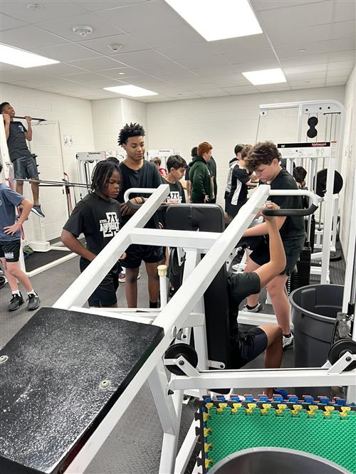 middle school students in weight room